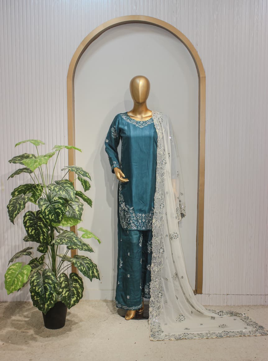 Teal Elegance — Embroidered 3-Piece Suit Teal blue embroidered 3-piece Pakistani outfit featuring a detailed kurta, stylish matching palazzo, and a sheer white embroidered dupatta
