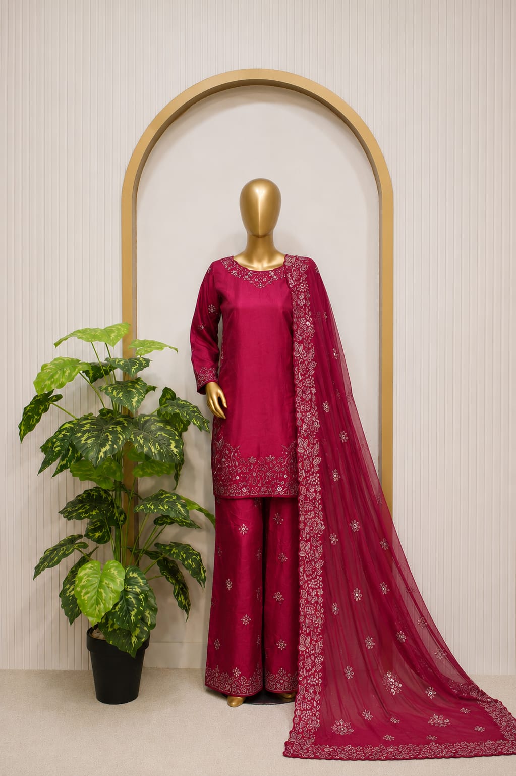 Shocking Pink Embroidered Ensemble Shocking pink embroidered 3-piece Pakistani outfit displayed on a mannequin, featuring a long embroidered shirt, matching stylish palazzo, and a sheer shocking pink dupatta with intricate floral embroidery and border detailing.